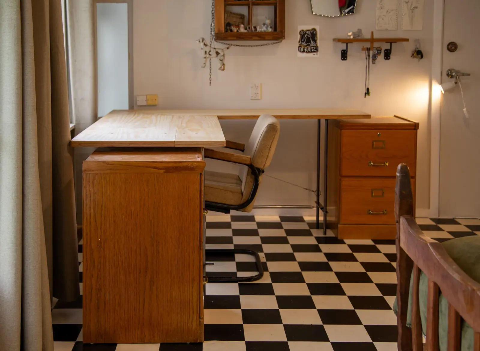 A self-led corner desk featuring plywood and steel components in a room setting.