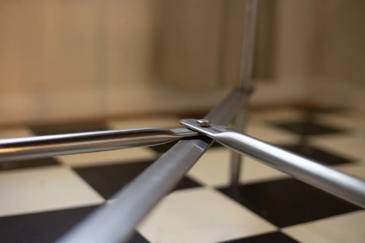 Close-up view of the steel frame corner joint, showing the connection point of the desk prototype.