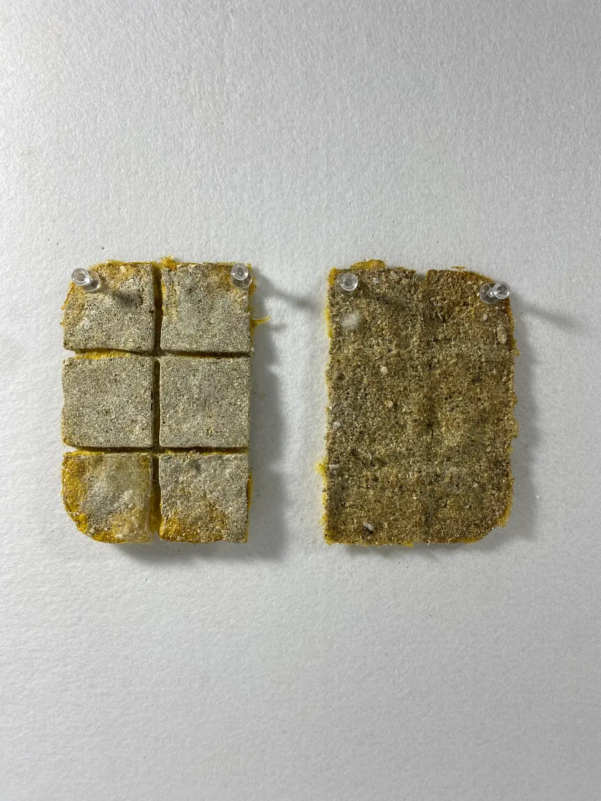 Un-processed wool combined with crushed eggshells and bio-plastic.